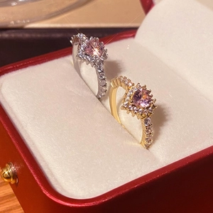 Elegant halo heart ring set with pink round stones and pavé bands in a gift box