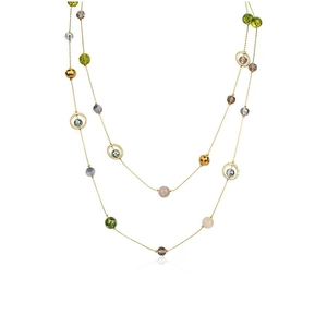 Close-up of triple-layered gold fringe necklace with colorful beads and metal rings