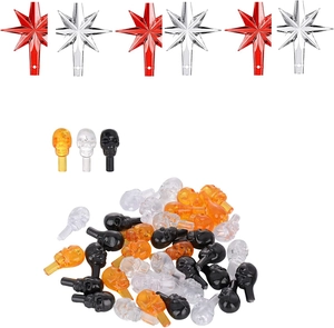 Assorted plastic star toppers and skull-shaped bulbs for ceramic Christmas tree decor
