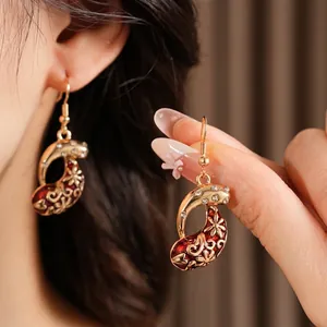 Vintage gold-plated teardrop earrings with red enamel floral hollow pattern and zircons