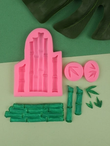 Pink silicone mold for bamboo and leaf cake decorations with green fondant samples