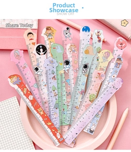 Close-up of 15cm acrylic cartoon rulers with cute astronaut and dinosaur illustrations