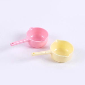 Miniature colorful dollhouse plastic water ladles in pink and yellow for kitchen play