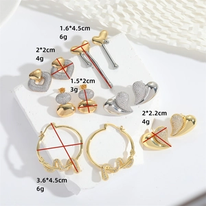 Romantic heart-shaped drop earrings in gold and silver finish with crystal zircon accents