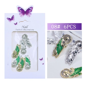 Macro detail of tulip-style metal nail charms with green enamel and rhinestones 6pcs