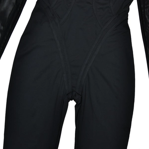 Detail view of black long sleeve bodysuit featuring sheer mesh panels and solid fabric