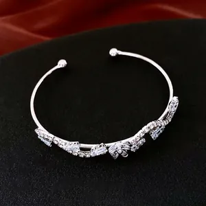Elegant silver-tone triple-layer open bangle with zircon butterflies on black display
