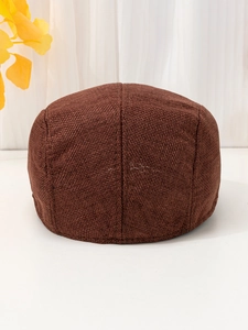 Detailed view of the dark brown breathable linen texture on a retro flat cap
