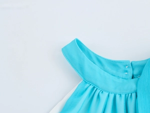 Detail of cyan chiffon halter neckline with pleated texture and fine stitching work