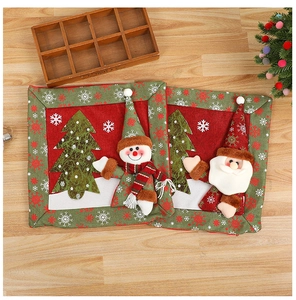 Detail of Christmas snowman placemats with 3D applique patterns on rustic burlap fabric