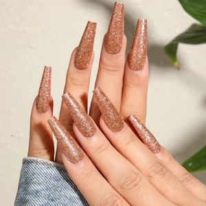Champagne gold glitter long ballet shape press-on nails with shiny rose gold sparkles