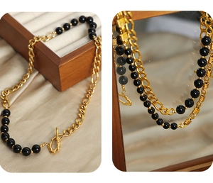 Detail of vintage black onyx bead necklace with gold-plated titanium OT toggle clasp