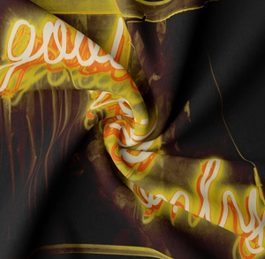 Macro shot of neon printed wall tapestry fabric showing soft texture and artistic lettering