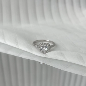 Macro view of S925 silver ring featuring a heart-shaped zircon and pave-set accents