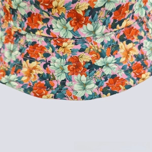 Close-up of vibrant floral print and reinforced stitching on a summer sun bucket hat