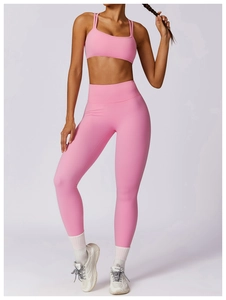 Pink quick-dry yoga set featuring thin strap sports bra and high-waist seamless leggings