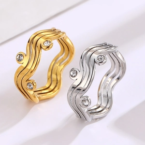 Minimalist wavy stainless steel rings in gold and silver with zircon stone settings