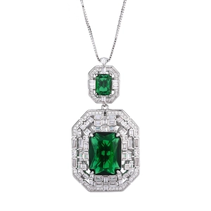 Elegant silver necklace featuring two emerald-cut green zircons with pavé diamond halo