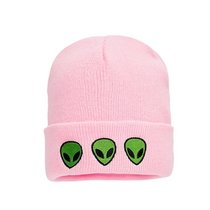 Pink knitted beanie hat featuring three green alien head embroidery in a casual style