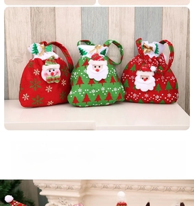 Detailed view of festive knitted Christmas drawstring gift bags with plush holiday characters