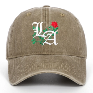 Detailed embroidery of gothic LA letters and red roses on khaki washed cotton cap