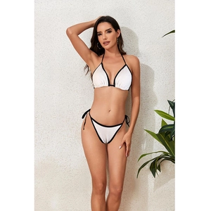 Sexy white triangle bikini set with black trim and wavy texture for beach vacations