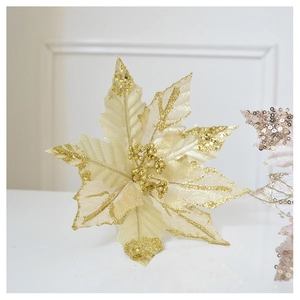 Detail of a sparkling gold glitter poinsettia flower for Christmas tree decoration