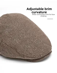 Detail of herringbone wool cap featuring an adjustable foldable brim and wide peak design
