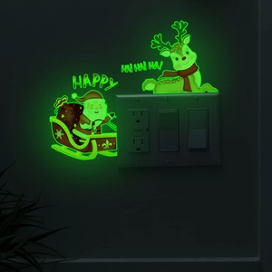 Glow-in-the-dark Christmas Santa and reindeer wall stickers on light switch panel