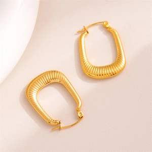 Minimalist rectangular gold earrings with striped texture in a modern U-shape style
