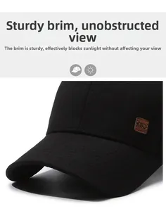 Close-up of men's black baseball cap with premium brown leather logo patch and stiff brim
