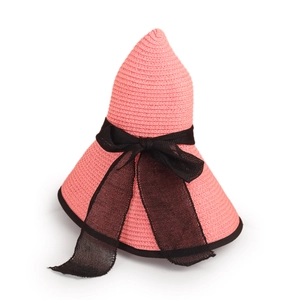 Detailed texture of pink straw sun hat with black mesh ribbon and woven edges