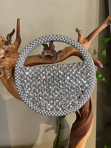 Handcrafted silver beaded round handbag with metallic reflective beads and top handle