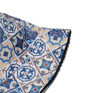 Detail of bohemian bucket hat with intricate geometric floral prints and canvas texture
