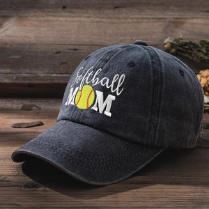 Detail of Softball MOM embroidery on washed dark grey baseball cap atop a wooden surface