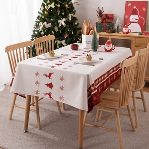 Waterproof polyester Christmas tablecloth featuring reindeer and trees in a festive setting