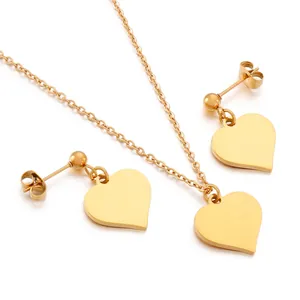 Minimalist gold heart jewelry set with polished mirror finish necklace and stud earrings