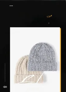 Close-up of thick knit beanie texture and fold-over cuff in grey and cream white