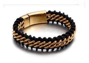 Macro detail of men's leather woven bracelet with 18K gold plated magnetic clasp