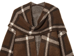 Close-up of thick brown plaid knitted fabric texture with soft folded collar detail