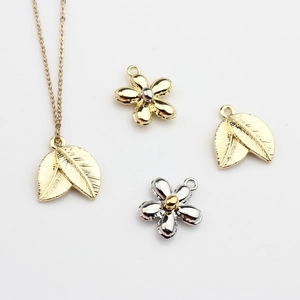 Minimalist alloy flower and leaf charms in gold and silver finish for DIY jewelry