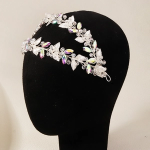 Detail of silver bridal headband with crystal leaf design and sparkling rhinestones
