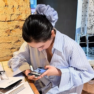 Korean style blue checkered oversized hair scrunchie shown in a casual lifestyle setting