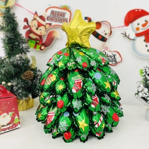 Christmas tree shaped foil balloon with gold star topper and holiday ornaments print