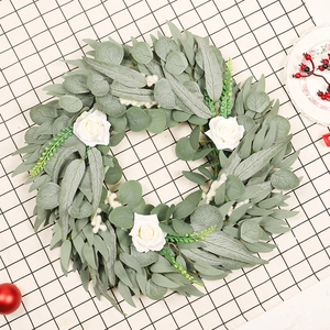 Artificial eucalyptus and white rose wreath for Christmas home wall decoration