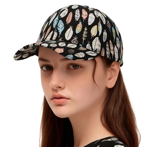 Detail of black baseball cap with colorful feather print on a female model