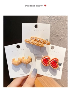 Three-piece fun hair clips featuring realistic croissant, baguette, and strawberry tart