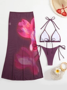 Detailed view of purple floral print mesh cover-up skirt with matching bikini set
