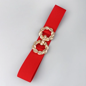 Detail of red elastic waist belt with a golden interlocking double-ring buckle