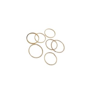 Minimalist gold ring set for women with 7 pieces featuring smooth and textured bands